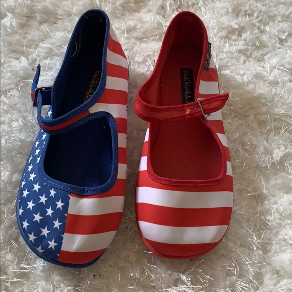 Red white and blue buckled flat shoes